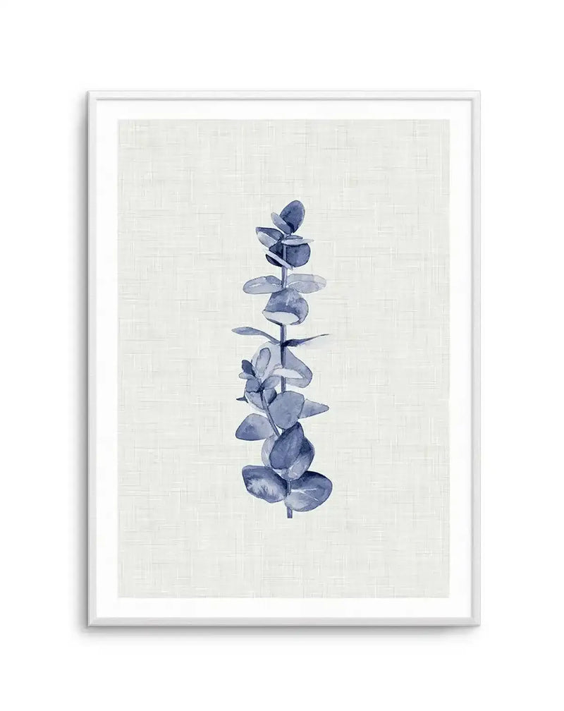 Watercolour art print featuring a single eucalyptus branch with round, blue-grey leaves arranged vertically on a textured off-white background, displayed in a white frame with white border.