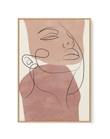 Framed canvas art print featuring minimalist line drawing of two abstract faces in profile with closed eyes and neutral expressions. Faces rendered in continuous black ink lines overlaid on organic shapes in dusty rose, mauve, and terracotta tones against cream background. Natural wood frame with white border. Contemporary illustration style with soft watercolor-like color fields and delicate linear details.