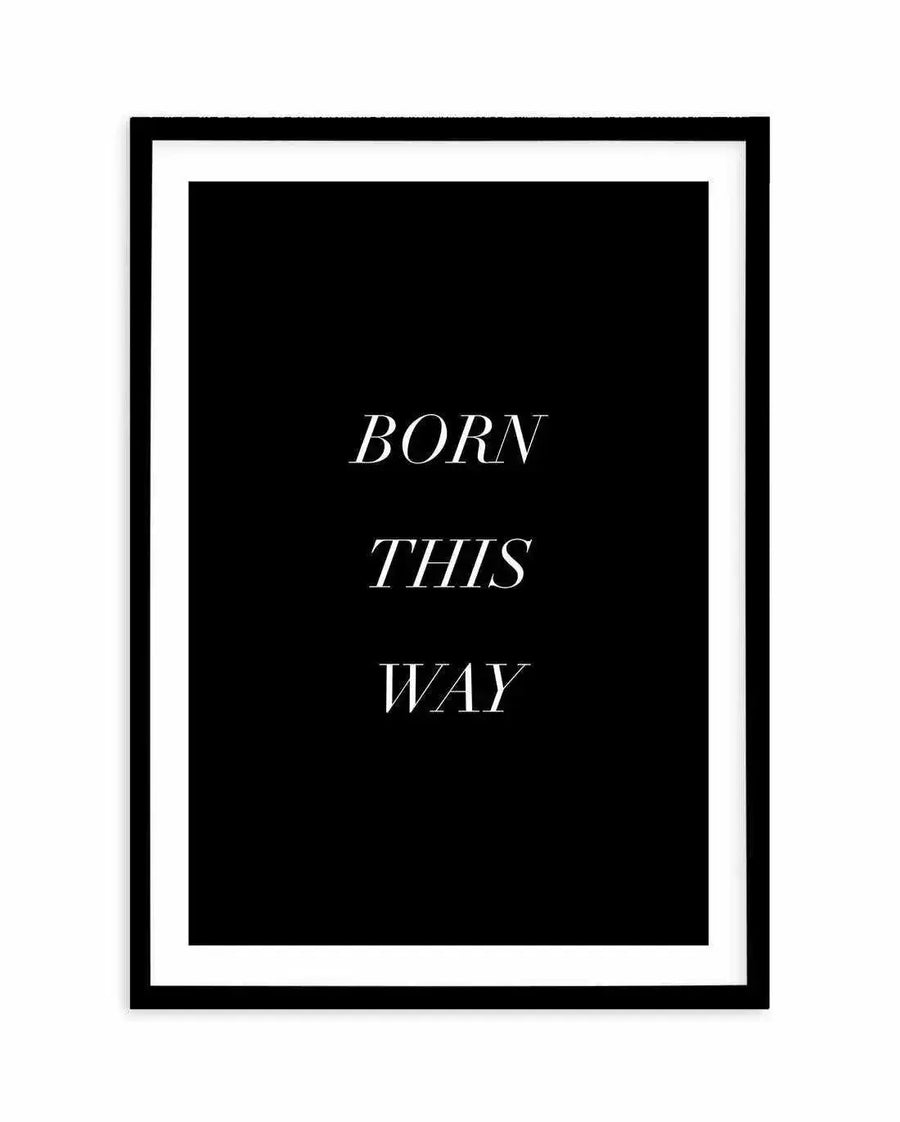 Art print featuring the words "BORN THIS WAY" in three lines of elegant white serif font on a solid black background, displayed in a black frame with a white border.