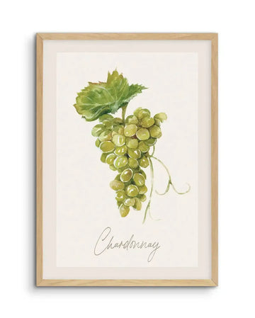 Watercolour art print featuring a bunch of green grapes with a single large green leaf and delicate tendrils, printed on fine art paper and displayed in a natural oak frame with white border. The word "Chardonnay" is written in elegant script below the grapes.
