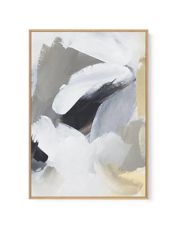Abstract canvas print featuring bold, expressive brushstrokes in a palette of cool greys, black, and white, with subtle hints of warm beige and pale yellow. The composition has a dynamic, layered quality, suggestive of movement and depth, and is displayed in a natural wood frame.