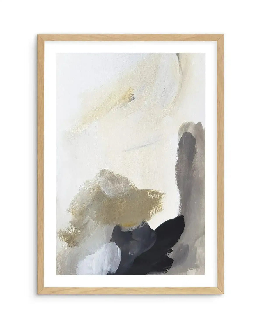 Abstract art print featuring broad, expressive brushstrokes in shades of warm beige, muted olive green, charcoal grey, and black, with accents of white, on a soft cream background, displayed in a natural oak frame with white border. The composition has a dynamic, layered quality with visible paint texture.