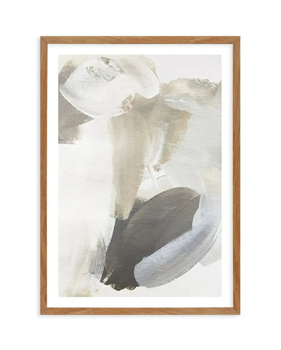 Abstract art print featuring broad, expressive brushstrokes in shades of warm beige, off-white, and deep charcoal grey, creating a dynamic and fluid composition. Printed on fine art paper and displayed in a natural oak frame with white border.