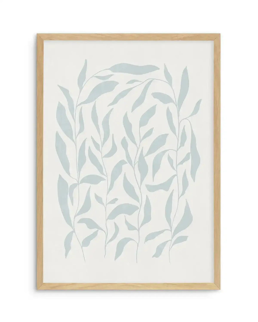 Watercolour art print featuring a repeating pattern of hand-painted botanical leaves in a muted, pale blue-green on a soft white background, displayed in a natural oak frame with white border. The leaves are depicted with a loose, organic quality, some appearing as individual stems and others as a cluster.