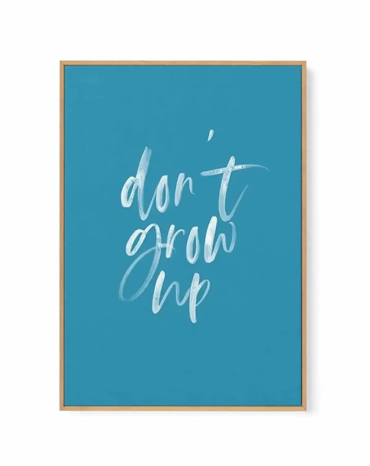 Don't Grow Up | Ocean Blue | Framed Canvas Art Print from Olive et Oriel where you can shop wallpaper and artworks online