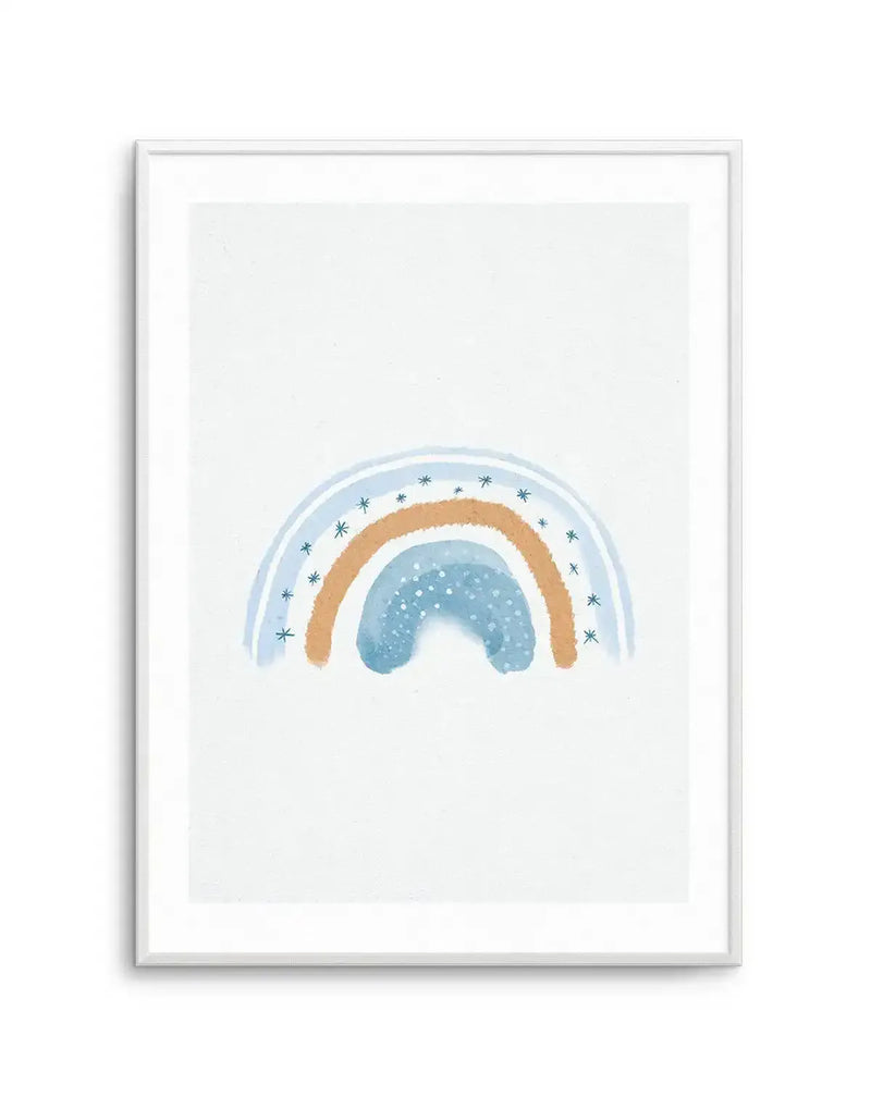 Watercolour art print featuring a dreamy rainbow in shades of blue and brown, with a light blue outer arc adorned with small white starbursts, a warm brown middle arc, and a darker blue inner arc with white speckles, all on a crisp white background, displayed in a white frame with a white border.