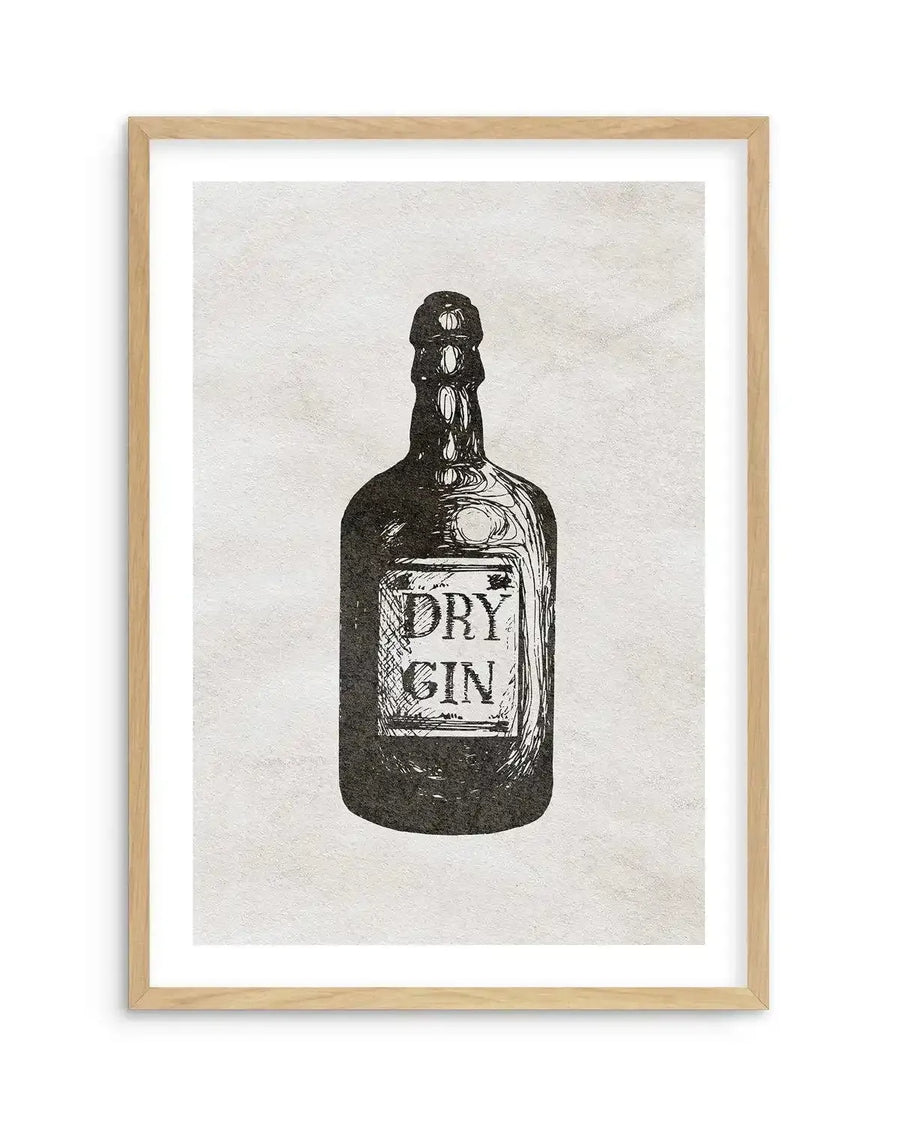 Black and white art print featuring a hand-drawn illustration of a vintage-style dry gin bottle with a label reading "DRY GIN" in a rustic font, displayed in a natural oak frame with white border.