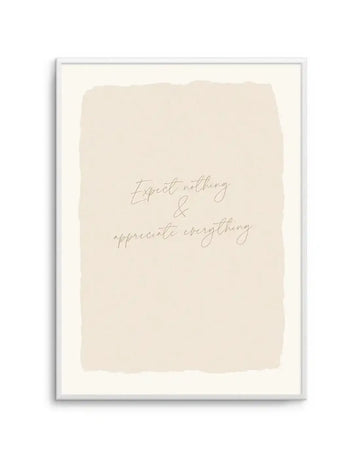 Art print featuring the handwritten quote "Expect nothing & appreciate everything" in a delicate script on a textured, torn-edge cream background, displayed in a white frame with a white border.