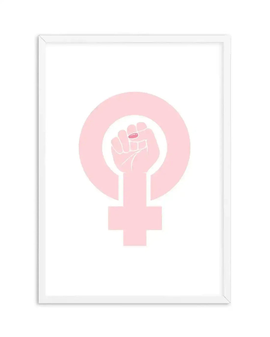 Art print featuring a pale pink female power symbol (Venus symbol) with a raised fist in the center, also in pale pink, holding a small, brighter pink pill. The illustration has a clean, graphic style on a white background and is displayed in a white frame with a white border.