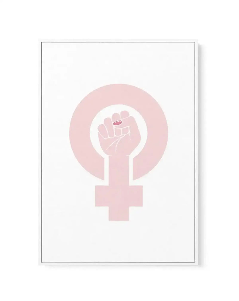 Framed canvas art print featuring a female power symbol in soft blush pink tones on a white background. The design shows a clenched fist raised upward integrated into a circular shape, positioned above the female gender symbol. The artwork has a minimalist, modern illustration style with subtle gradient shading. The canvas is mounted in a thin gray frame with a white border, displayed against a neutral background.