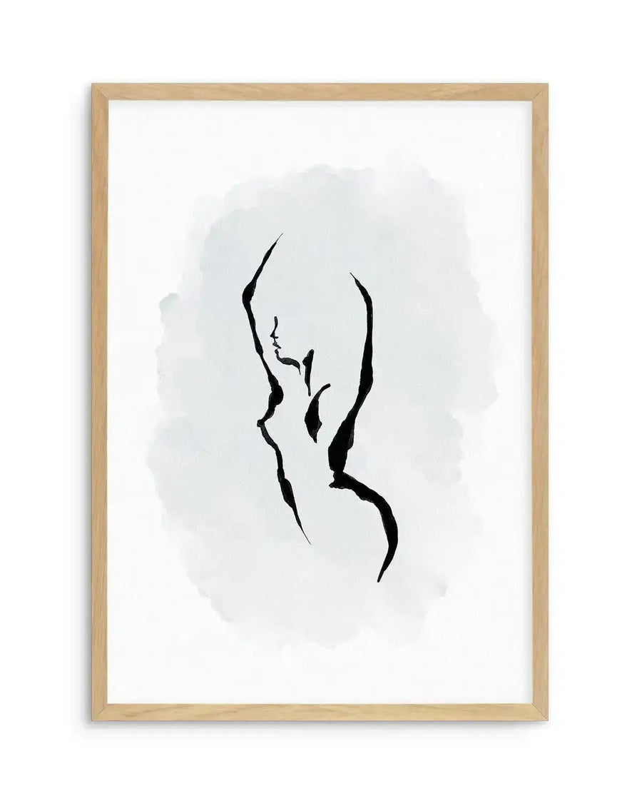 Line art print featuring a minimalist depiction of a female torso and head in profile, rendered with thick black brushstrokes against a soft periwinkle blue watercolour wash background. The artwork is displayed in a natural oak frame with white border.