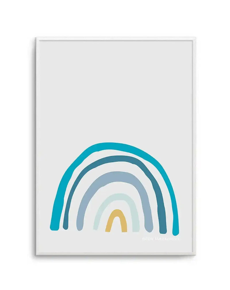 Art print featuring a hand-painted rainbow illustration with five arches in varying shades of blue, teal, and a single golden yellow arch at the bottom, on a plain white background. The text "follow the rainbows" is subtly printed in the bottom right corner.