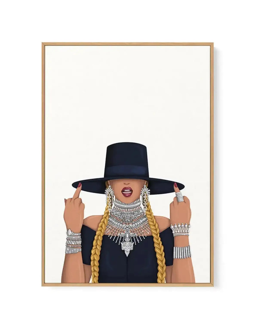 Framed canvas print featuring an illustration of a woman from the chest up, wearing a black off-the-shoulder top, a wide-brimmed black hat obscuring her eyes, and long blonde braids. She is adorned with multiple silver necklaces, earrings, bracelets, and rings, and has red lipstick. Her hands are raised, each with an extended middle finger, against a plain white background, displayed in a natural oak frame.