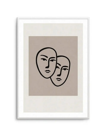 Framed art print featuring two minimalist line-drawn faces in black ink on a warm taupe background, with a cream-colored border and white frame. The faces are rendered in a simple, continuous-line style, positioned slightly overlapping, facing forward with subtle facial features including eyes and lips. The composition has a modern, abstract quality with a neutral, contemplative mood.