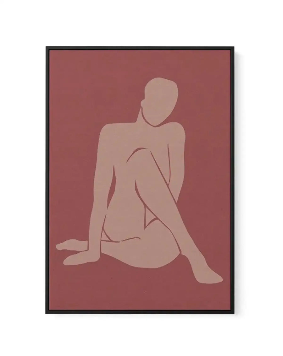 Framed canvas art print featuring a minimalist line drawing of a seated female figure in profile against a dusty rose background. The figure is rendered in soft, warm beige tones with simple curved lines defining the body contours. The composition shows a woman sitting with legs extended, head turned slightly, in a contemplative pose. The artwork has a modern, understated aesthetic with muted earth-tone coloring. The canvas is surrounded by a black frame.
