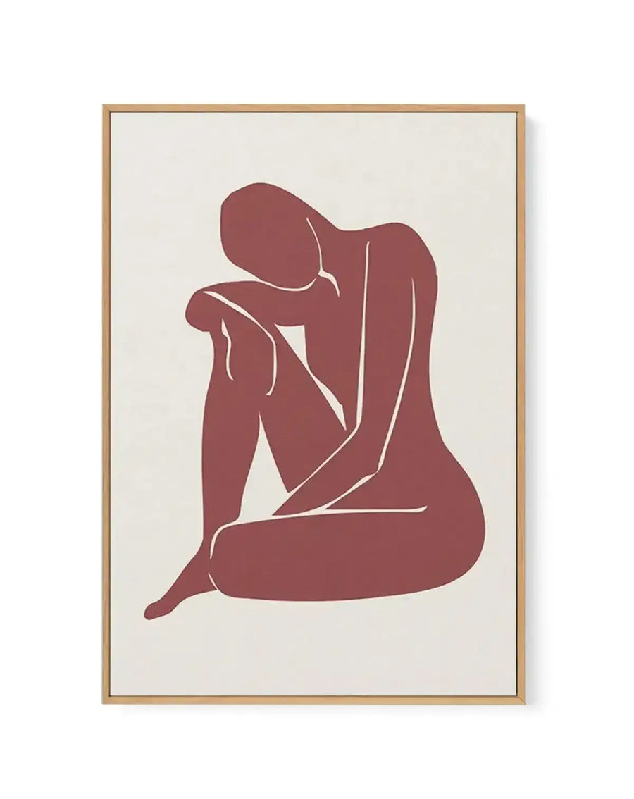 Framed canvas art print titled "Forme Feminine II" featuring a minimalist line drawing of a seated female figure in deep burgundy red against a cream background. The figure is rendered in a simplified, abstract style with white contour lines defining the body's curves and form. The canvas is mounted in a natural wood frame with a white border. The composition is vertical and centered on the neutral canvas.