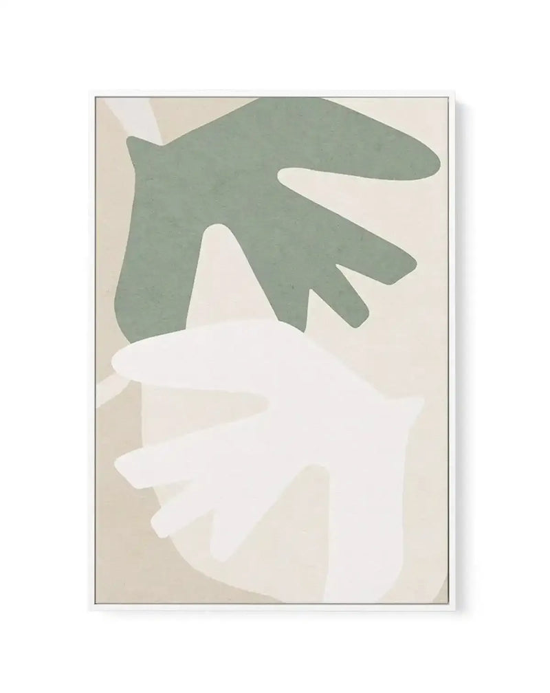 Abstract canvas print featuring two large, organic shapes resembling stylized bird wings or leaves. The top shape is a muted sage green, and the bottom shape is a soft white, both set against a warm, light beige background with subtle, lighter beige abstract forms. The print is displayed in a thin white frame.