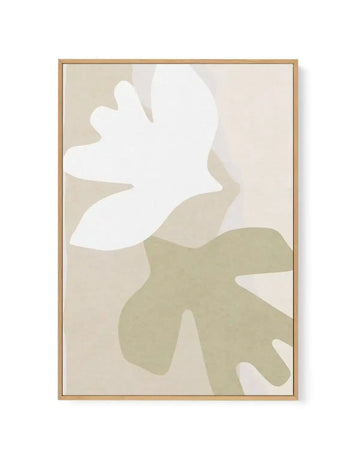 Abstract canvas print featuring two organic, fluid shapes in a minimalist composition. The upper shape is a soft white, resembling a dove or a leaf, while the lower shape is a muted sage green, overlapping slightly with the white. Both shapes are set against a warm, light beige background with a subtle textured finish. The canvas is displayed in a natural oak frame.
