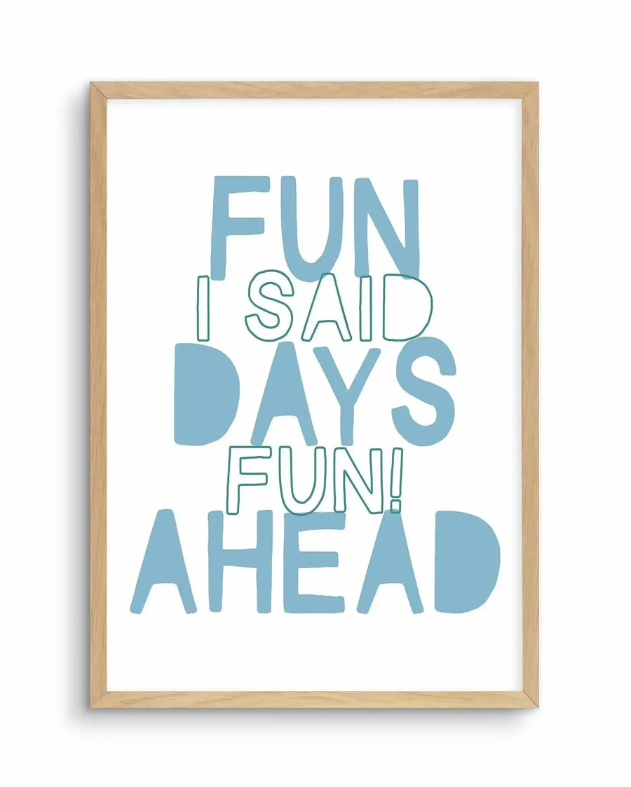 Framed art print with light natural wood frame displaying motivational text in shades of teal and blue-green. The design reads "FUN I SAID DAYS FUN! AHEAD" with varying font weights and styles on a white background. Some letters use solid fills while others use outlined strokes, creating visual interest in the typography-focused composition.