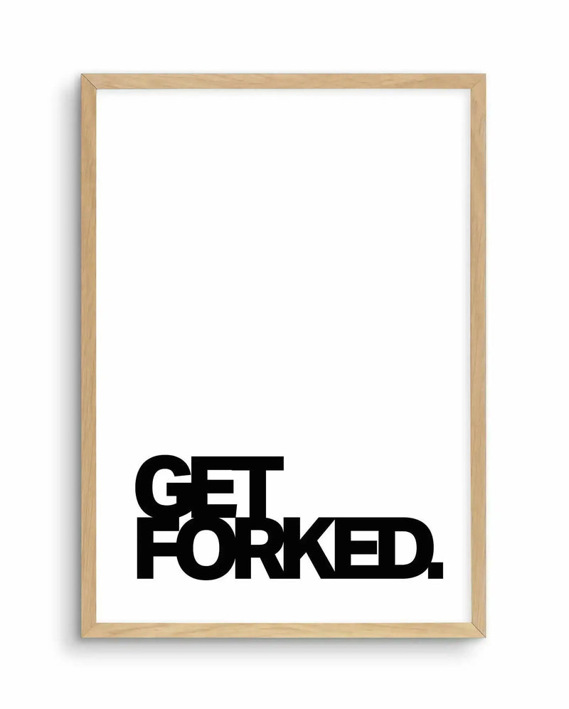 Art print in light natural wood frame displaying bold black sans-serif typography reading "GET FORKED." on a clean white background. The text is positioned in the lower portion of the frame, leaving substantial white space above. The frame has a warm, blonde wood finish with visible grain texture and a simple profile. The overall composition is minimalist and modern with high contrast between the thick, geometric letterforms and the bright white background.