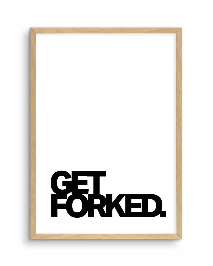 Art print in light natural wood frame displaying bold black sans-serif typography reading "GET FORKED." on a clean white background. The text is positioned in the lower portion of the frame, leaving substantial white space above. The frame has a warm, blonde wood finish with visible grain texture and a simple profile. The overall composition is minimalist and modern with high contrast between the thick, geometric letterforms and the bright white background.