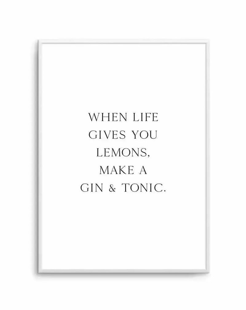 Art print featuring the quote "WHEN LIFE GIVES YOU LEMONS, MAKE A GIN & TONIC." in black serif font on a crisp white background, displayed in a thin white frame.