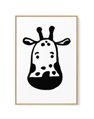 Black and white line illustration of a giraffe's head and neck facing forward, framed in natural wood. The giraffe features two tall horns, simple dot eyes, and a pattern of black spots across its white face and neck. The illustration has a minimalist, graphic style with bold black outlines. Displayed in a light tan wooden frame with white background.