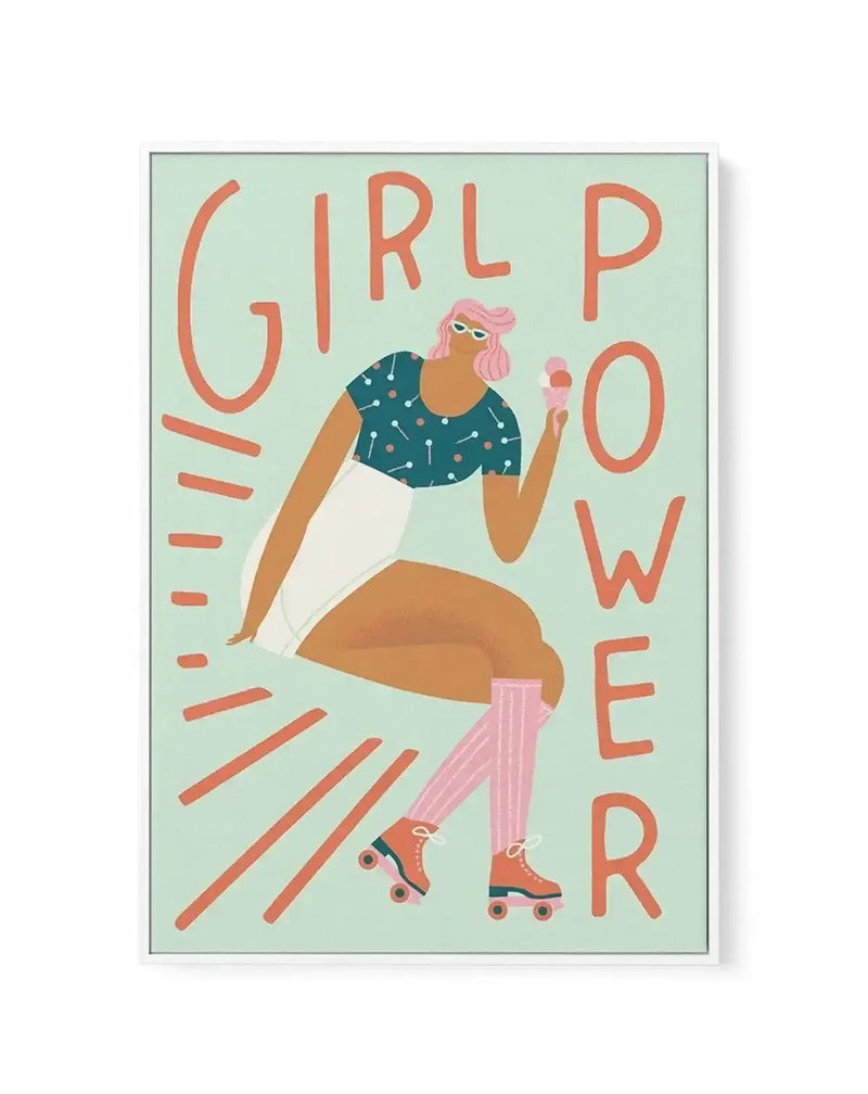Framed canvas print featuring a vibrant illustration of a woman with pink hair, wearing sunglasses, a polka-dot top, and white shorts, sitting and holding an ice cream cone. She is wearing pink striped knee-high socks and roller skates. The background is a light mint green, with the words "GIRL POWER" in large, orange, stylized letters, and orange radiating lines around the figure.