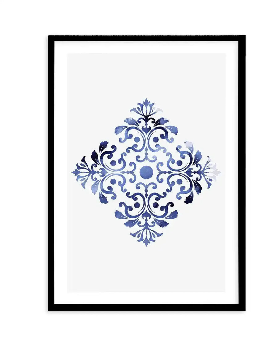 Watercolour art print featuring a symmetrical diamond-shaped motif of intricate blue and white floral and scroll patterns, with a central blue circle, displayed in a black frame with white border.