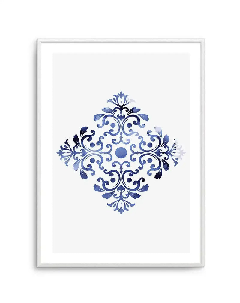 Watercolour art print featuring a symmetrical, diamond-shaped ornate scroll pattern in varying shades of blue, from deep navy to light sky blue, on a crisp white background, displayed in a white frame with a white border.