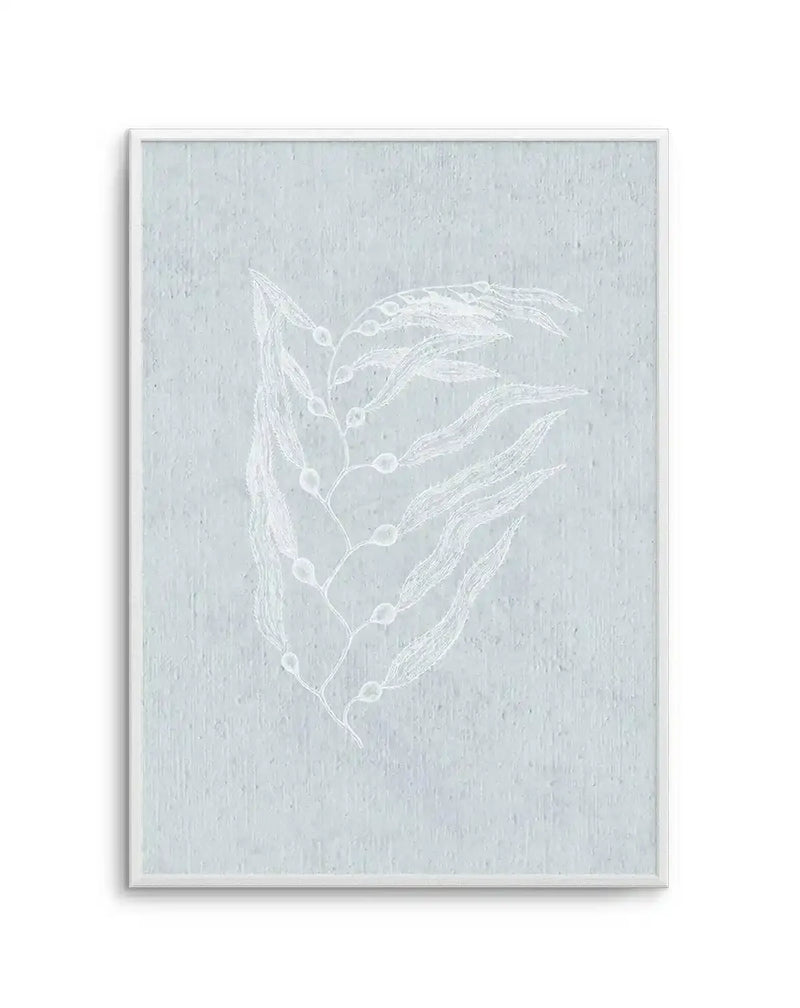 Framed art print featuring a minimalist botanical illustration on a soft sage green textured background. White line drawing depicts a delicate branch with elongated leaves and small berries arranged vertically. The artwork has a subtle, ethereal quality with fine details rendered in white against the muted green surface. White wooden frame with white border. Portrait orientation.