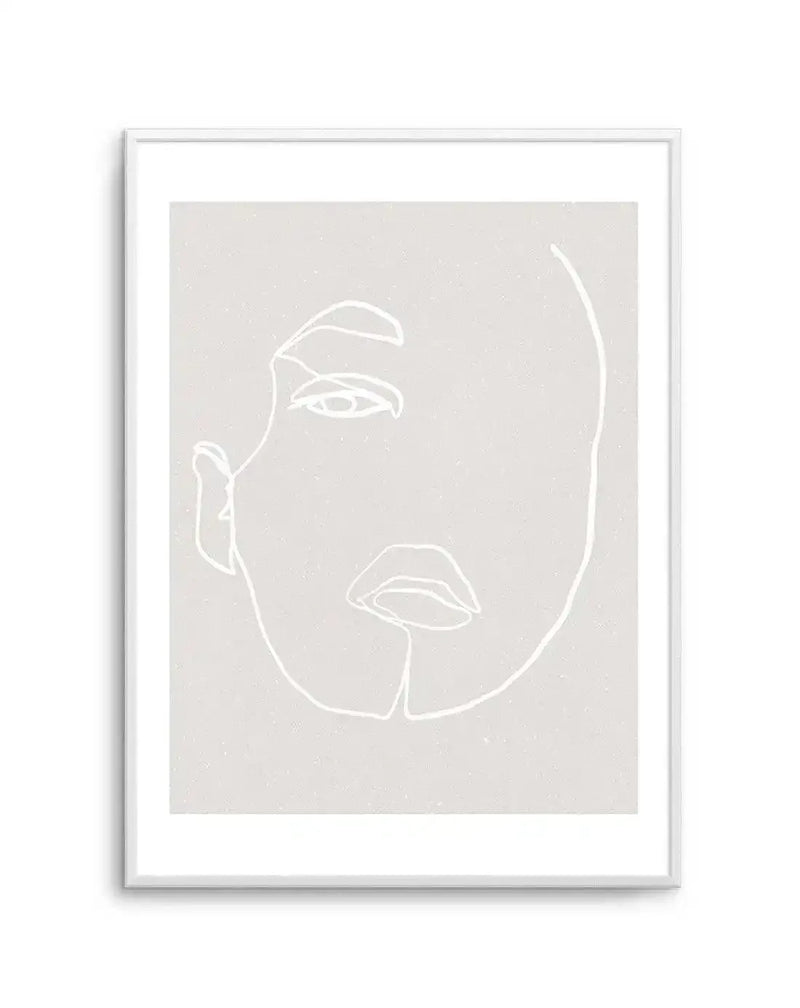 Line art print featuring a minimalist illustration of a woman's face in white on a light grey background with a subtle speckled texture, displayed in a white frame with white border. The composition shows the left side of the face, with an eye, eyebrow, nose, and lips defined by continuous, flowing lines.
