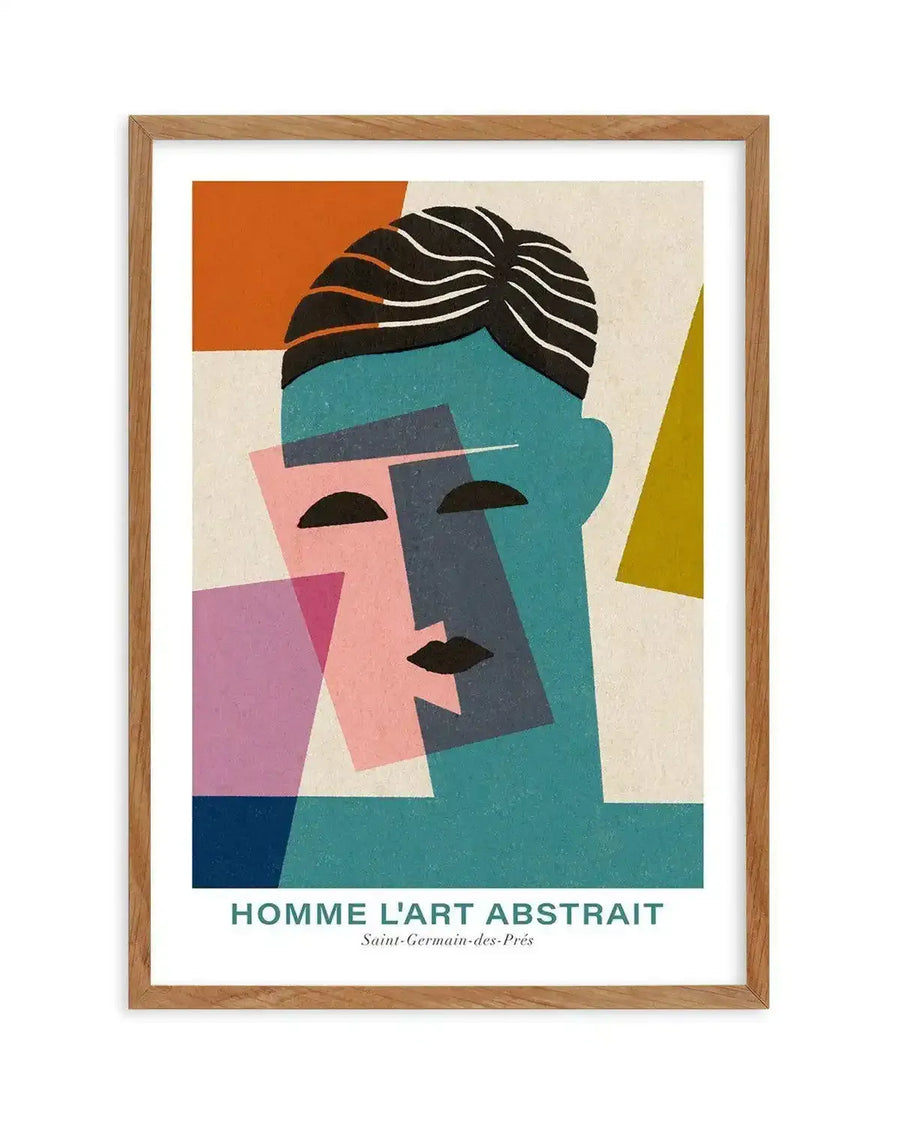 Abstract art print featuring a stylized portrait of a man's face composed of geometric shapes in teal, pink, purple, and dark blue, with black lines for hair and facial features, printed on fine art paper and displayed in a natural oak frame with white border.