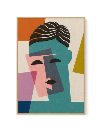 Abstract geometric portrait of a stylized face with black linear hair rendered in white strokes. The face is composed of overlapping rectangular shapes in teal, dusty rose, soft pink, and charcoal gray. Black semicircular eyes and a black lips accent the composition. Bright orange, olive-green, navy blue, and cream colored geometric blocks frame the portrait. The artwork is rendered in flat, bold colors with a modernist aesthetic, displayed in a natural wood frame with white border.