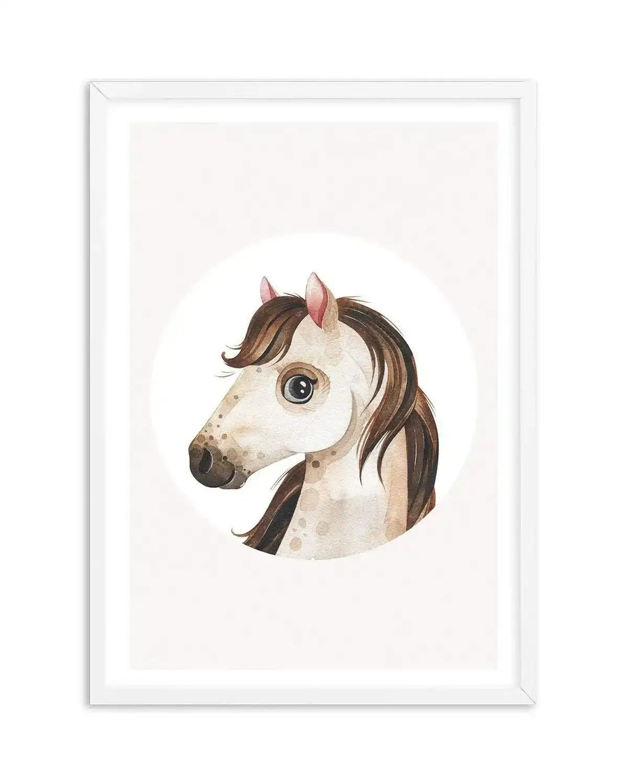 Watercolour art print featuring the head of a horse with a light cream coat, brown mane, and small pink ears, displayed in a white frame with a white border. The horse has large, dark eyes and subtle brown speckles on its face and neck, with a gentle, illustrative style.