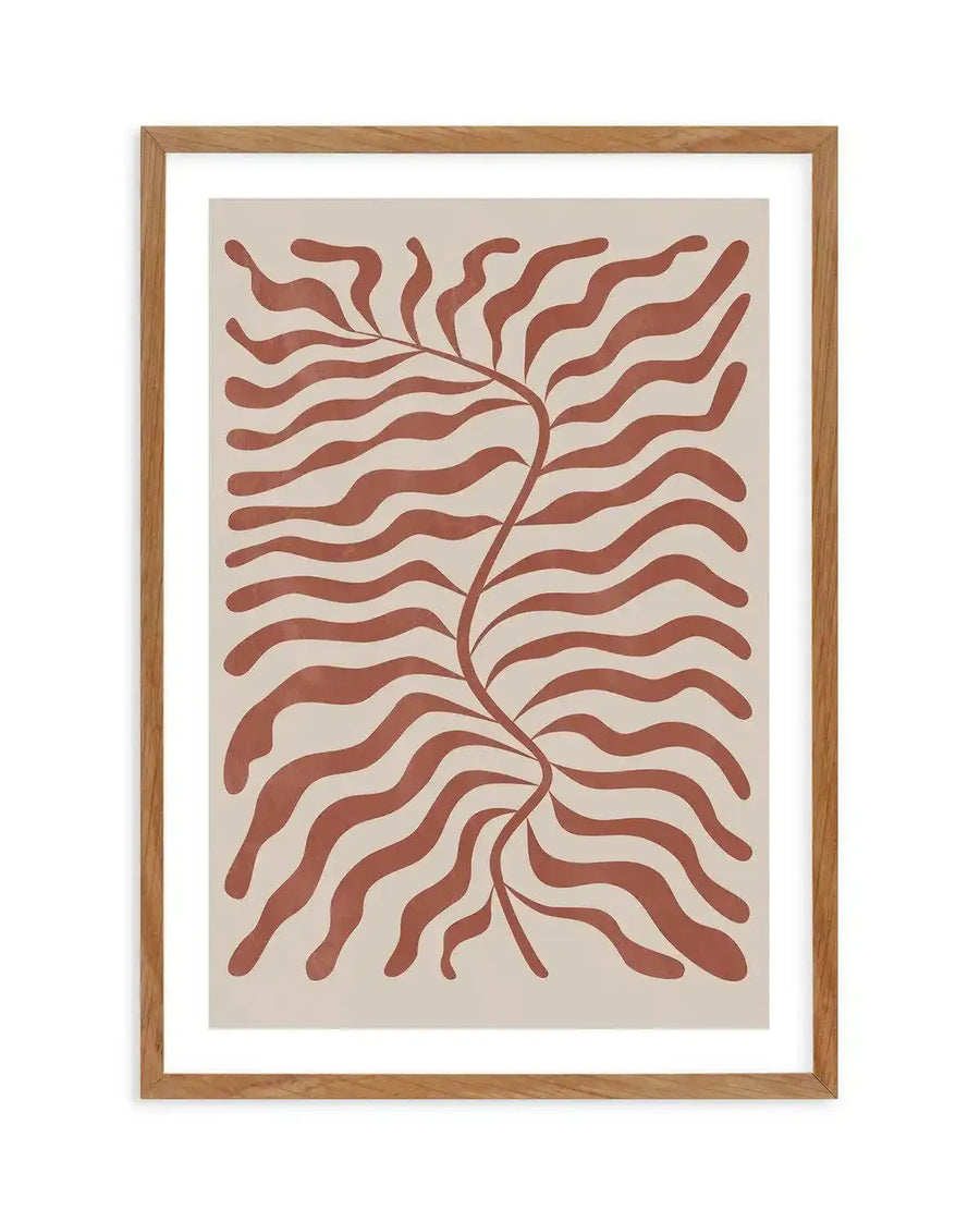 Abstract art print featuring a central winding stem with numerous wavy, organic leaf-like shapes extending horizontally, all in a warm red earth tone against a light cream background, displayed in a natural oak frame with white border.