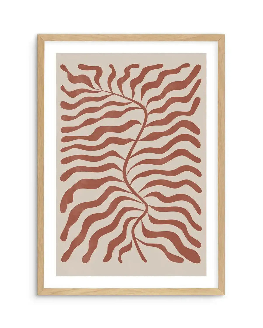 Abstract art print featuring a central winding stem with wavy, organic leaf-like shapes in a warm red earth tone, set against a light beige background. The design has a hand-drawn, flowing quality and is displayed in a natural oak frame with a white border.
