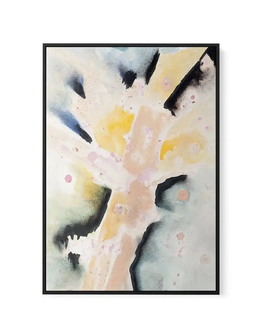 Abstract art print featuring a dynamic composition of soft, blended watercolour brushstrokes in pale yellow, peach, and light blue, with bold, dark grey and black gestural marks and subtle pink splatters, printed on canvas and displayed in a black frame.