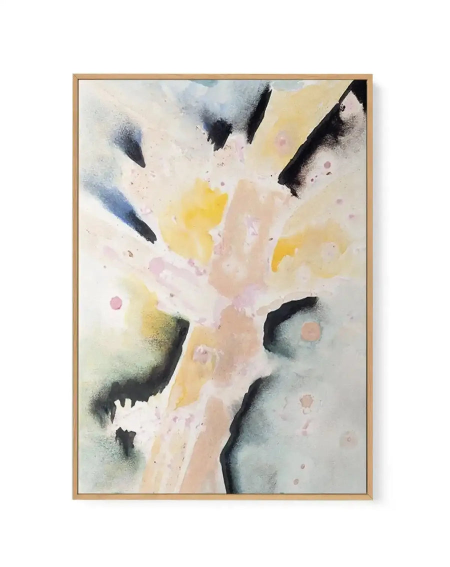 Framed canvas art print featuring an abstract watercolor composition with soft, flowing washes of cream, pale yellow, dusty rose, and sage green across the center. Bold black brushstrokes and charcoal-like marks radiate from the edges toward the middle, with scattered dots in mauve and terracotta throughout. The painting has a delicate, ethereal quality with translucent layers and organic shapes. The canvas is mounted in a natural wood frame with a white border.