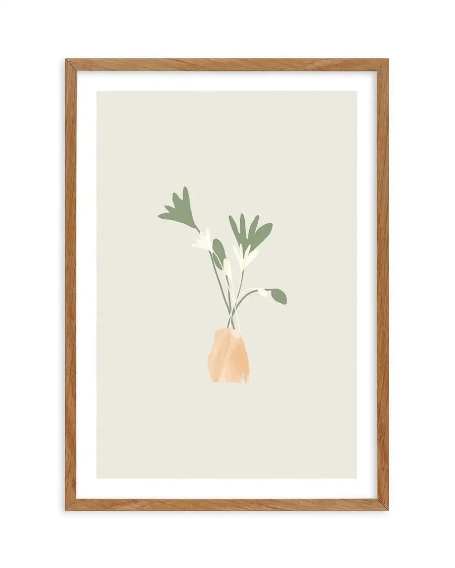 Art print featuring a minimalist illustration of three stylized flowers and leaves in muted sage green and off-white, arranged in an abstract peach-coloured vase, printed on fine art paper and displayed in a natural oak frame with white border