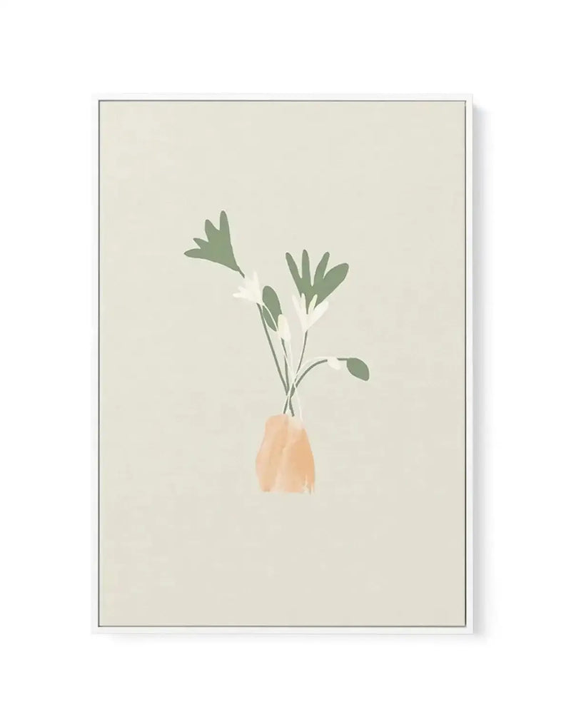 Framed canvas art print featuring a minimalist illustration of green leafy stems in a peachy-tan ceramic vase against a cream background. The artwork has a soft, muted watercolor aesthetic with organic brushwork. The canvas is set in a thin gray frame with a white border, displayed on a white background.