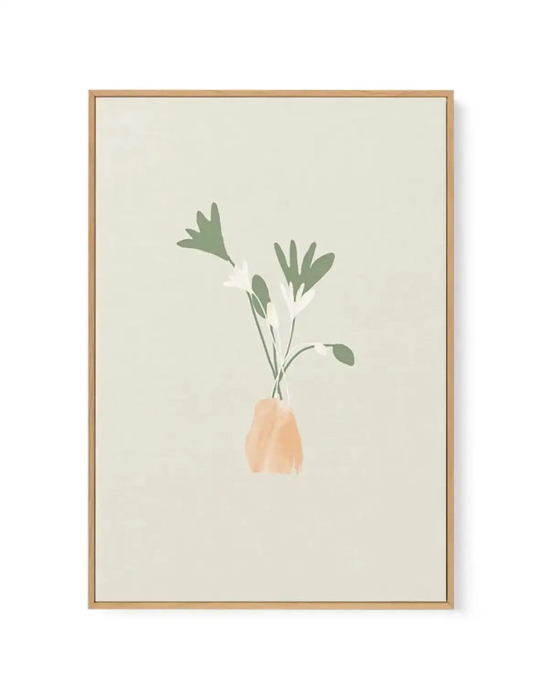 Framed canvas art print featuring a minimalist botanical illustration on a cream background. A single stem with green leaves and small white flowers emerges from a peachy-beige vase positioned in the center-lower portion of the composition. The artwork has a soft, watercolor-like quality with muted earth tones. The canvas is set in a natural wood frame with a white border, displayed against a neutral background.