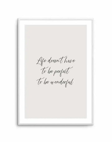 Art print featuring the handwritten quote "Life doesn't have to be perfect to be wonderful" in black script on a light grey background, displayed in a white frame with white border.