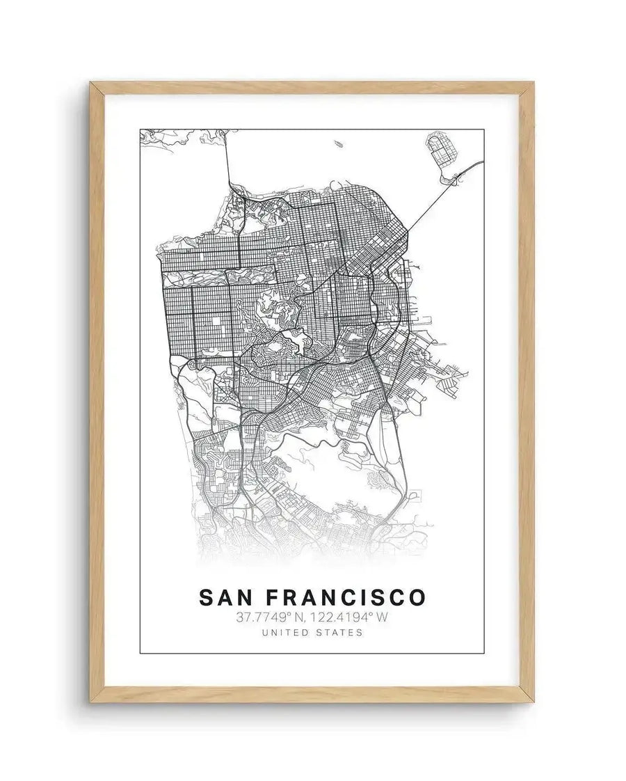 Line art map print of San Francisco, featuring a detailed street network and coastal outlines in black on a white background, displayed in a natural oak frame with white border. The print includes the city name, coordinates, and "UNITED STATES" text at the bottom.