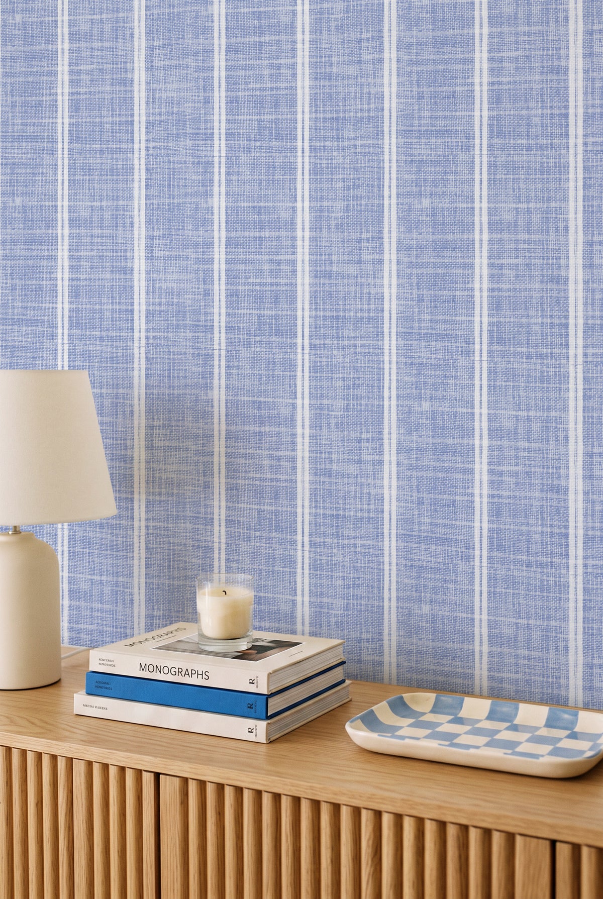 Sky Blue Linen Double Stripe linen wallpaper styled above a timber console