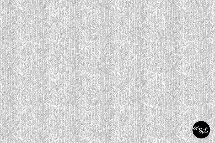 Peel and stick wallpaper featuring a repeating pattern of hand-drawn herringbone lines in light grey on a white background. The pattern has a subtle, organic texture with visible pencil-like strokes.