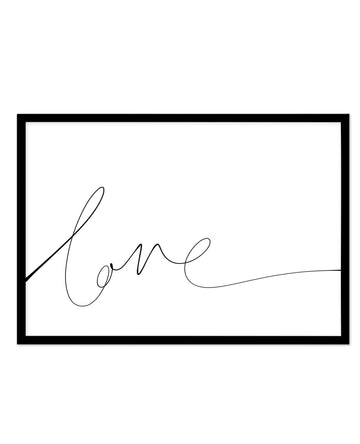 Hand-scripted art print featuring the word "Love" written in flowing, cursive black ink on a white background. The lettering is loose and organic with elegant loops and flourishes, creating a minimalist line drawing style. The print is displayed in a black rectangular frame with a white border. The composition is centered horizontally with the script positioned in the lower-left to center area of the frame, leaving substantial white space above and to the right.