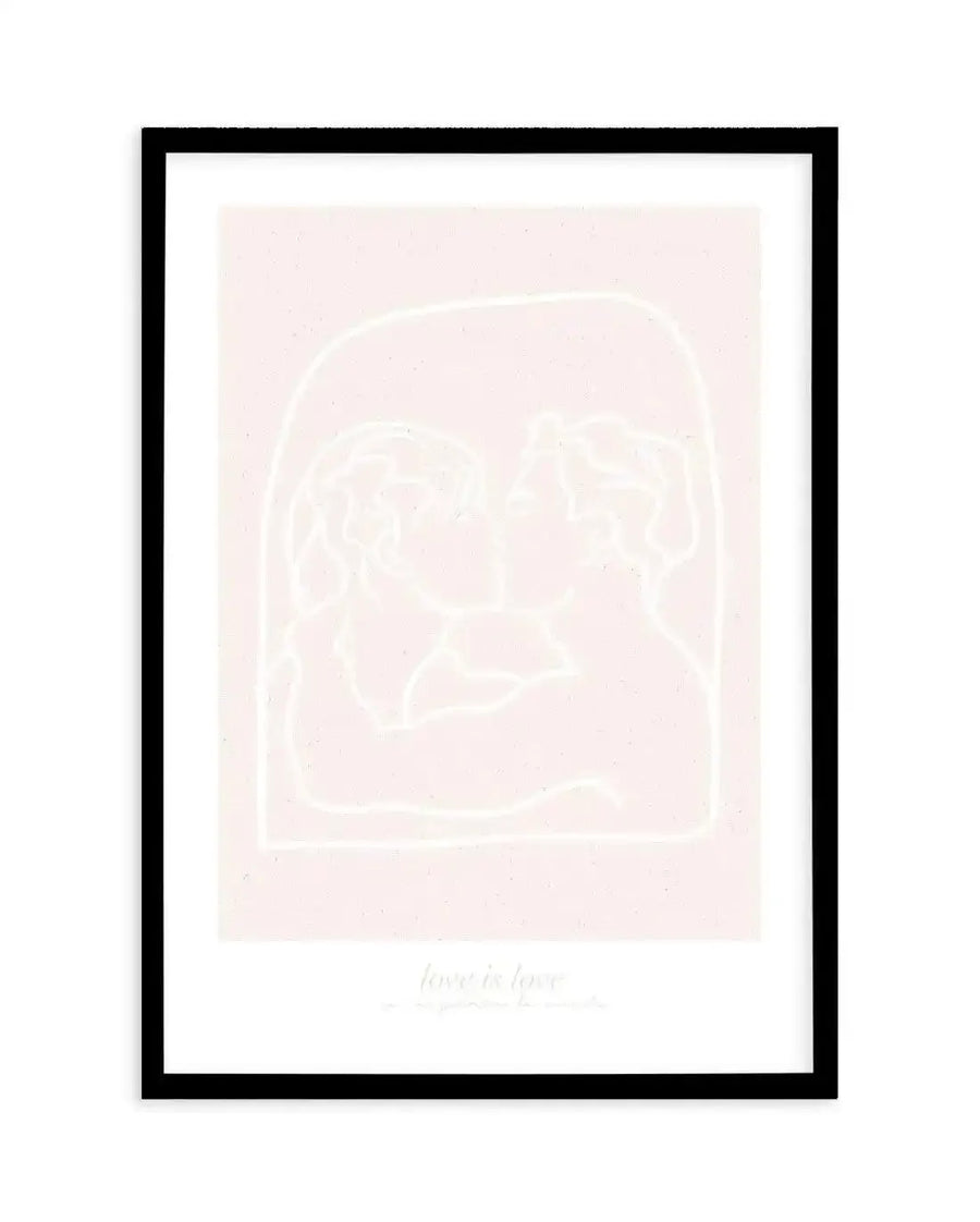 Art print featuring a minimalist line drawing of two figures kissing, outlined in white against a soft blush pink background with a subtle speckled texture, enclosed within a white arch, and displayed in a black frame with a white border. The text "love is love" is subtly visible at the bottom.