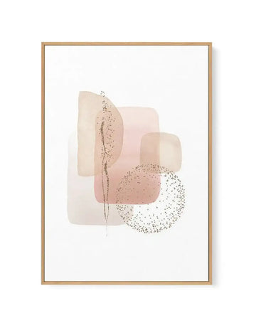 Framed canvas art print featuring abstract watercolor-style composition with overlapping geometric shapes in soft, muted tones of cream, blush pink, and taupe. A delicate vertical line with scattered sparkle details runs through the center. Circular element with fine dotted texture in warm beige appears in the lower right. Natural wood frame with white border surrounding the artwork on white background.