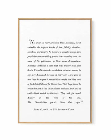 Framed canvas art print with natural wood border featuring an excerpt from the June 26, 2015 U.S. Supreme Court marriage equality decision. The text is printed in black italic serif font on a white background, beginning with "No union is more profound than marriage..." and ending with "The Constitution grants them that right." The wood frame has a warm tan finish with visible grain texture and a subtle shadow effect along the right and bottom edges.